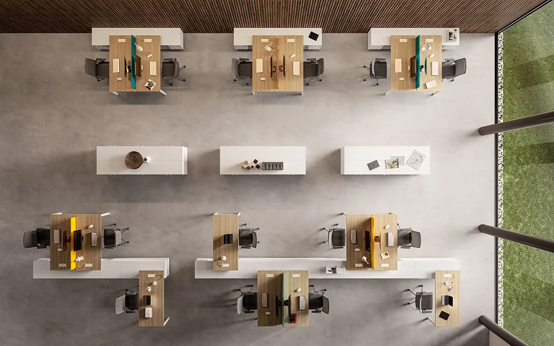 Postazioni bench allestite in un ampio ufficio open space